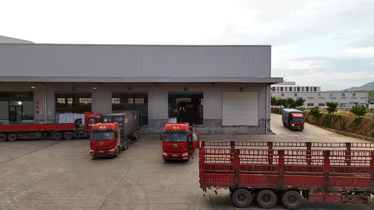 Container trucks loading at the dispatch bays